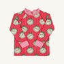 Cassidy Comfy Crewneck - Distinguished Doggies with Hamptons Hot Pink long-sleeved shirt featuring a red and pink stripe pattern with dog illustrations in scalloped green wreaths, finished with a ruffled pink collar and cuffs.