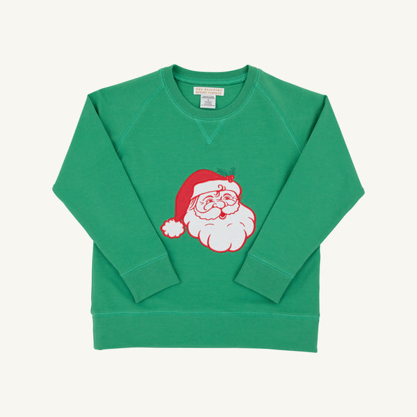 The Beaufort Bonnet Company’s Cassidy Comfy Crewneck in Kiawah Kelly Green features a cheerful Santa motif with Santa Claus wearing a red hat in the center, displayed on a plain white background—perfect for Christmas gatherings.