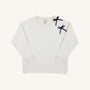 The Beaufort Bonnet Company’s Cassidy Comfy Crewneck – Quilted Palmetto Pearl with Nantucket Navy Bows – is a white quilted sweatshirt with long sleeves, ribbed cuffs and hem, and two small navy bows on the left shoulder, offering both style and comfort.