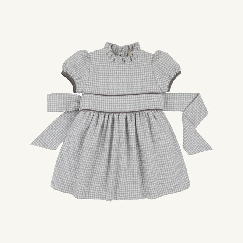 Cindy Lou Sash Dress - Grantley Gray Houndstooth featuring a ruffled collar, puff sleeves, and a back-tie sash.