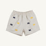 Introducing the Michigan Critter Sheffield Shorts in Saratoga Stone by The Beaufort Bonnet Company. These light beige shorts feature an elastic waistband and are adorned with embroidered blue and yellow Michigan logos throughout, combining comfort with spirited University of Michigan style.