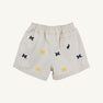 The Beaufort Bonnet Company’s Michigan Critter Sheffield Shorts in Saratoga Stone feature an elastic waistband, embroidered blue and yellow Michigan logos, and a small back pocket with a label and bird icon. These shorts combine comfort and school spirit for any fan.
