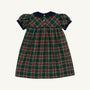 The Dale Dress - Pinehill Plaid with Nantucket Navy by The Beaufort Bonnet Company is a short-sleeved, knee-length girls’ fall dress featuring a green, red, and white plaid pattern, accented with a Nantucket Navy collar and front buttons.