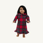 A doll with long dark hair wearing a Dolly’s Goldie Locks Nightgown - Society Prep Plaid featuring a Peter Pan collar, long sleeves with ruffled cuffs, and a ruffled hem.