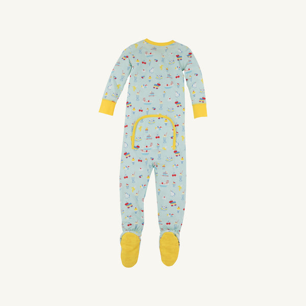 The Beaufort Bonnet Company’s Fallon Footie Pajamas – Ice Cream Daydream (Blueberry Blue) with Nana Banana—feature a soft cotton jersey in a light blue hue, long sleeves, and yellow cuffs and feet. This cozy footed onesie is decorated with colorful playful prints of animals and vehicles, and includes a convenient buttoned flap on the back.
