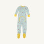 The Beaufort Bonnet Company’s Fallon Footie Pajamas – Ice Cream Daydream (Blueberry Blue) with Nana Banana—feature a soft cotton jersey in a light blue hue, long sleeves, and yellow cuffs and feet. This cozy footed onesie is decorated with colorful playful prints of animals and vehicles, and includes a convenient buttoned flap on the back.