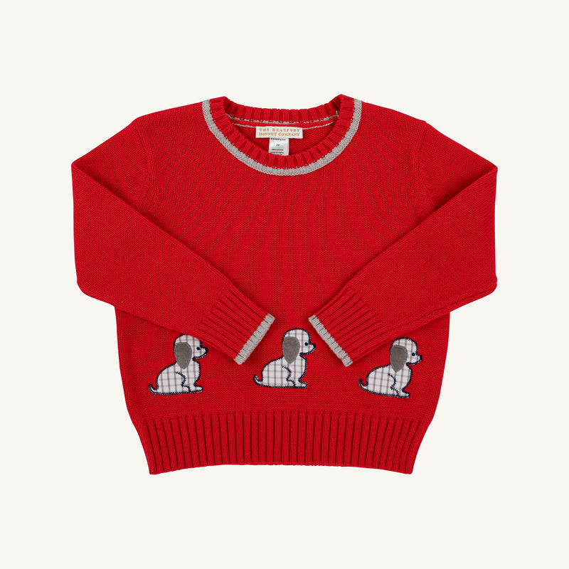 Isaac’s Intarsia Sweater - Richmond Red with Grantley Gray and Dogs is a long-sleeved red sweater with a gray ribbed collar and cuffs, decorated with three plaid dog appliqués across the front hem.