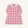 The Beaufort Bonnet Company Lindy’s Lunch Dress - Broadway Play Plaid with Worth Avenue White is a long-sleeved pink and purple plaid holiday dress with a white rounded collar and two white buttons at the waist.