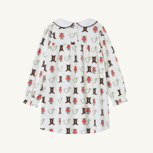 Long Sleeve Banks Bow Dress - Happy Hunting with Palmetto Pearl & Nantucket Navy by The Beaufort Bonnet Company, crafted from soft Pima cotton knit and featuring a playful print of brown boots, red flowers, and green watering cans. This charming fall dress has a rounded collar and is shown from the back.