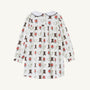 Long Sleeve Banks Bow Dress - Happy Hunting with Palmetto Pearl & Nantucket Navy by The Beaufort Bonnet Company, crafted from soft Pima cotton knit and featuring a playful print of brown boots, red flowers, and green watering cans. This charming fall dress has a rounded collar and is shown from the back.