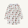 Long Sleeve Banks Bow Dress - Happy Hunting with Palmetto Pearl & Nantucket Navy by The Beaufort Bonnet Company, crafted from soft Pima cotton knit and featuring a playful print of brown boots, red flowers, and green watering cans. This charming fall dress has a rounded collar and is shown from the back.