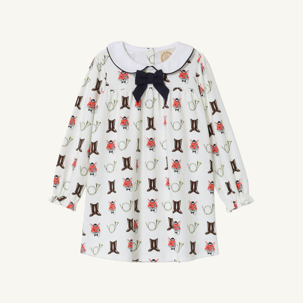 The Beaufort Bonnet Company’s Long Sleeve Banks Bow Dress - Happy Hunting with Palmetto Pearl & Nantucket Navy is crafted from soft Pima Cotton Knit. This long-sleeve white dress features a Nantucket Navy bow and an adorable print of cowboy boots, horseshoes, and red flowers. Finished with a Peter Pan collar detailed in dark trim, it’s the perfect fall dress for your little one.
