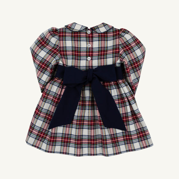 Long Sleeve Cindy Lou Sash Dress in Paris Pike Plaid with Nantucket Navy, featuring a rounded collar, three back buttons, and a large navy blue bow at the waist.