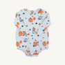 The Beaufort Bonnet Company’s Long Sleeve Patton Play Bubble from the Candy & Critters collection features playful orange jack-o-lanterns, ghosts, and leaves printed on soft Buckhead Blue Pima Cotton Knit for a festive Halloween look.