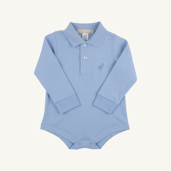 Long Sleeve Prim & Proper Polo & Onesie in Beale Street Blue with Barrington Blue Stork by The Beaufort Bonnet Company, crafted from soft Pima Cotton Onesie fabric. Features a polo collar, three buttons, and an embroidered Barrington Blue stork on the left chest. Snaps at the bottom allow for easy diaper changes. Shown laid flat on a white background.