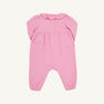 The Long Sleeve Ramona Ruffle Romper - Hamptons Hot Pink with Wreath Embroidery by The Beaufort Bonnet Company is crafted from soft Pima Cotton and features a charming scalloped collar, button details on the chest, and gathered fabric at the waist. Designed for comfort with elastic hems at the legs and wrists, this festive romper makes a perfect holiday outfit and is shown laid flat on a light background.