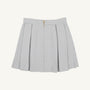 Parson Pleated Skirt - Grantley Gray Houndstooth featuring a gray and white houndstooth pattern, pleated design, and a gold back zipper.