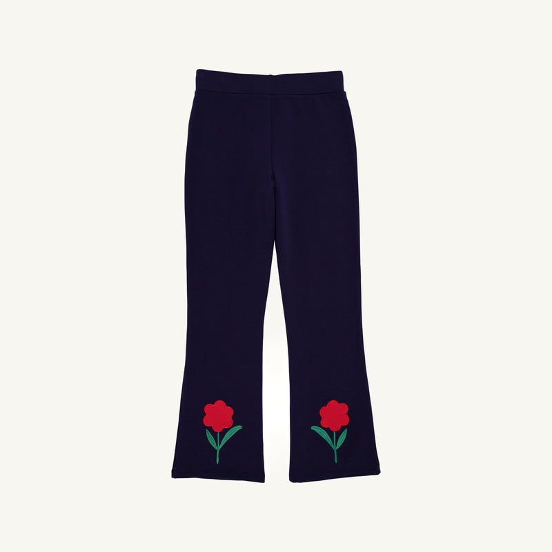 Patty Pants - Nantucket Navy & Richmond Red with Flowers are navy blue bootcut pants with a slight flare at the hem and an embroidered flower appliqué on each leg, perfect for a girls’ transitional wardrobe.