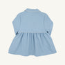 A children’s long-sleeve Pippa Peacoat from The Beaufort Bonnet Company, shown from the back in Barrington Blue with Palmetto Pearl accents. Reminiscent of the classic Barrington Blue coat, it features a gathered waist, white piping detail, and a collar. The peacoat is displayed against a plain white background.