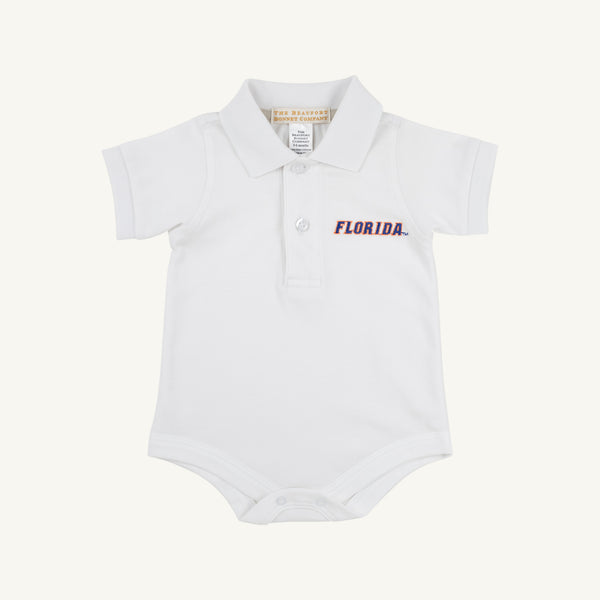 The Florida Prim & Proper Polo – Worth Avenue White by The Beaufort Bonnet Company is a white baby onesie with a collar, short sleeves, and an embroidered blue and orange Florida logo on the left chest. Made from soft Pima Cotton Knit, this onesie features three buttons at the neck and convenient snaps at the bottom.