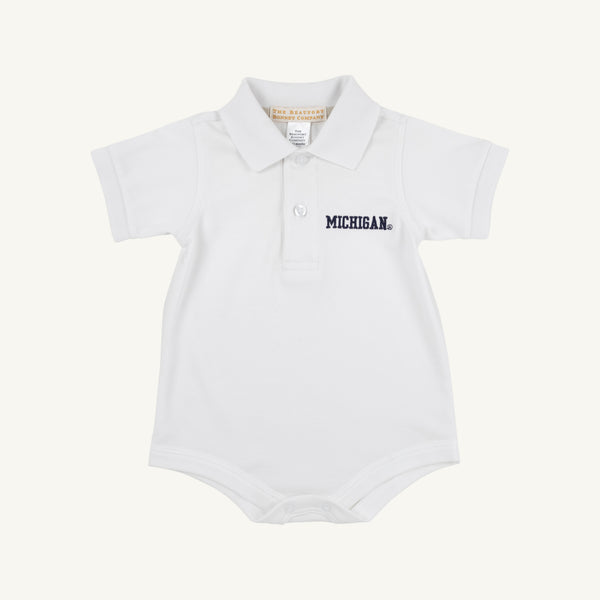 A white baby onesie expertly crafted from soft Pima Cotton Knit, featuring a classic collar, two-button placket, and the Michigan logo embroidered in navy blue on the left chest. Inspired by The Beaufort Bonnet Company’s Michigan Prim & Proper Polo - Worth Avenue White.
