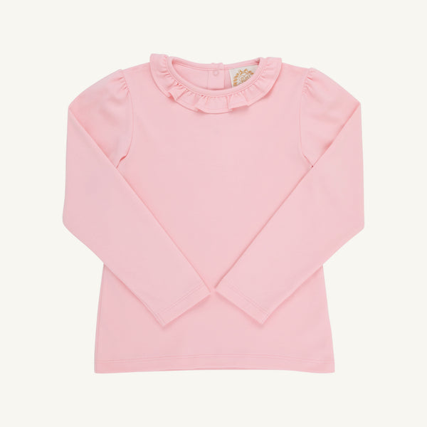 The Beaufort Bonnet Company’s Reece Ruffle Top in Sandpearl Pink is a long-sleeve toddler shirt with a ruffled collar, crafted from soft Pima Cotton and shown flat on a white background—an ideal choice for your autumn wardrobe.