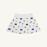 Introducing the Michigan Searcy Skort - Bold in Blue with Worth Avenue White by The Beaufort Bonnet Company, a stylish white Pima cotton skort featuring playful blue M letters, yellow flags, pink pom-poms, and megaphones for a fun school spirit and cheerleading vibe—the perfect new addition to your gameday outfit.