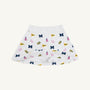 The Michigan Searcy Skort by The Beaufort Bonnet Company features Worth Avenue White Pima cotton with a comfortable elastic waistband and a bold, scattered pattern of blue “M” letters, yellow pennants, pink pom-poms, and megaphones—making it the perfect choice for a spirited gameday look.