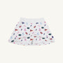 Crafted by The Beaufort Bonnet Company, the Florida Searcy Skort - Florida Forever with Worth Avenue White features a soft Pima Cotton Knit fabric with a comfortable elastic waistband. This white skort is adorned with the playful Florida Forever print, showcasing colorful footballs, pom-poms, pennants, letter Fs, and megaphones on a crisp background.