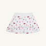 The Alabama Searcy Skort - Sweet Home Honey with Worth Avenue White by The Beaufort Bonnet Company features playful red and pink cheerleader, pom-pom, megaphone, and flag patterns. Made from soft Pima Cotton Knit, this skort offers a wide elastic waistband and attached shorts for added comfort.