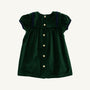 Here’s a rewritten version using your product data: The Beaufort Bonnet Company’s Short Sleeve Patsy’s Party Dress in Grier Green Velveteen with Nantucket Navy, a holiday dress for children, features short puff sleeves, a wide collar trimmed in navy, and a row of gold buttons down the back, displayed on a plain white background.