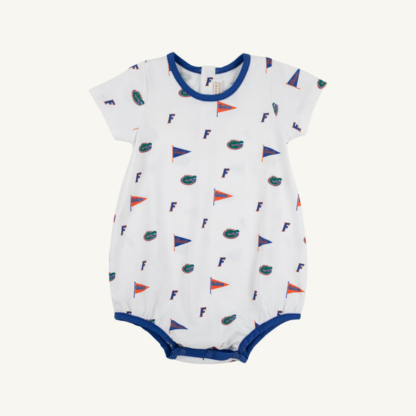 The Beaufort Bonnet Company’s Florida Short Sleeve Patton Play Bubble - Florida Forever with Florida Blue is a white baby romper adorned with a repeating print of small orange and blue flags, F letters, and alligator logos. Made from 100% Pima Cotton for ultimate comfort and softness, this short sleeve bubble features blue trim and convenient snap buttons at the bottom.