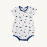 The Beaufort Bonnet Company’s Florida Short Sleeve Patton Play Bubble - Florida Forever with Florida Blue is a white baby romper adorned with a repeating print of small orange and blue flags, F letters, and alligator logos. Made from 100% Pima Cotton for ultimate comfort and softness, this short sleeve bubble features blue trim and convenient snap buttons at the bottom.