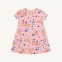 Introducing the Polly Play Dress - Candy & Critters (Sandpearl Pink) by The Beaufort Bonnet Company. This short-sleeve girls’ dress features whimsical Halloween-themed prints, including pumpkins, black cats, witches, ghosts, bats, and leaves in shades of purple, orange, and black. Made from soft Pima Cotton for lasting comfort and durability. Shown here displayed flat on a white background.
