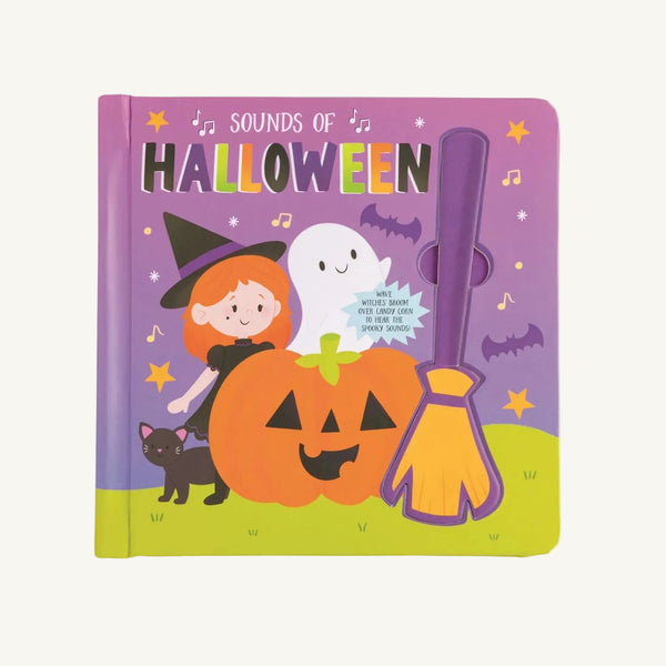 Witch Halloween Sound Book - Mud Pie by The Beaufort Bonnet Company features a children’s Halloween book cover with a witch, ghost, pumpkin, black cat, broom, bats, and musical notes set on a purple background. The cover text reads “Sounds of Halloween”. This interactive sound book lets kids explore spooky noises with every turn of the page.