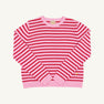 The Beaufort Bonnet Company Women’s Cissy Sweater in Pier Party Pink & Richmond Red Stripe, crafted from cotton with long sleeves, a crew neckline, and ribbed cuffs and hem, is shown laid flat on a white background. This festive sweater can be paired with the matching Reece Ruffle Sweater or worn alone as a standout piece.