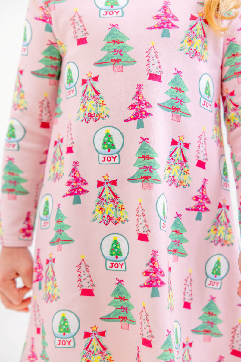 Long Sleeve Polly Play Dress - Christmas Coloring Contest in light pink Pima cotton featuring a repeating pattern of snow globes labeled JOY and evergreen trees.