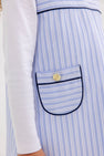 The Jill Jumper - Park City Periwinkle Stripe with Nantucket Navy is a light blue and white striped jumper featuring dark blue piping on the pocket and a gold button.