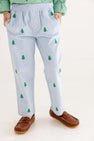 A child wears The Beaufort Bonnet Company Critter Sheffield Pants in Buckhead Blue Corduroy with Christmas Trees, paired with a green checkered shirt and brown loafers. With hands in pockets, only the lower half of the body is visible against a plain background.
