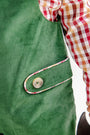 A close-up of The Beaufort Bonnet Company’s Ivy League Longall in Grier Green Corduroy, featuring a buttoned pocket flap and worn over an Easton Pond Plaid shirt in red, yellow, and white.