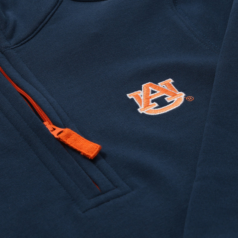 The Beaufort Bonnet Company’s Auburn Hayword Half-Zip in Auburn Blue with Auburn Orange features an orange zipper and an embroidered interlocking orange AU logo on the chest—perfect for game day layering.