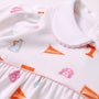 Close-up of The Beaufort Bonnet Company’s Tennessee Britt Bubble - Victory in Orange with Palm Beach Pink, a white baby dress trimmed in pink and adorned with orange and pink Tennessee-themed prints, including a pennant, dog mascot, T logo, and an orange bag labeled “Soda.” Crafted from soft Pima Cotton for comfort and style.