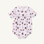 The Beaufort Bonnet Company’s USC Britt Bubble - South Carolina Spirit with Palm Beach Pink is a white baby romper with short sleeves and a Peter Pan collar, crafted from soft Pima Cotton. It features an all-over print of maroon, pink, and brown sports-related icons—including pennants, foam fingers, and megaphones—for a charming display of South Carolina Spirit.