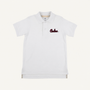 The South Carolina Prim & Proper Polo in Worth Avenue White by The Beaufort Bonnet Company is a white short-sleeve polo shirt featuring a collar, buttons, and an embroidered red South Carolina logo on the left chest. Crafted from soft Pima Cotton Knit, this polo offers a clean, classic look with its plain white background.