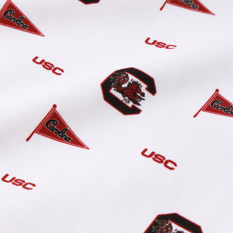 The USC Cassidy Comfy Crewneck by The Beaufort Bonnet Company showcases classic South Carolina Spirit with a design featuring repeating USC motifs, small Carolina pennants, and bold “C” logos with the Gamecock mascot in red, white, and South Carolina Burgundy tones. Crafted from fabric that is smooth with a subtle texture, this crewneck radiates timeless school pride.