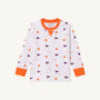 A long-sleeved child’s Clemson Cassidy Comfy Crewneck – Tiger Triumph with Clemson Orange by The Beaufort Bonnet Company, featuring orange cuffs and collar, white fabric, and a pattern of orange tiger paw prints and purple pennants.