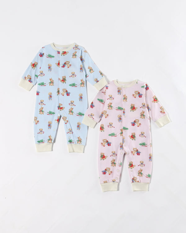Two Paxton Playsuits from The Beaufort Bonnet Company—one in Christmastime Cuties (Blue) with Palmetto Pearl and one in pink—each featuring an adorable animal and floral print, displayed on a white background; perfect as cozy Pima Cotton playsuits or festive holiday baby outfits.