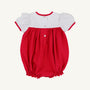Dress your little one in festive style with the Cindy Lou Bubble by The Beaufort Bonnet Company. This holiday baby outfit features puff sleeves, a white Worth Avenue White top with a charming Christmas Tree detail, and a bright Richmond Red bottom. It’s designed with three buttons down the back, red trim on the sleeves, and elasticized leg openings for a comfortable fit—perfect for celebrating the season!.