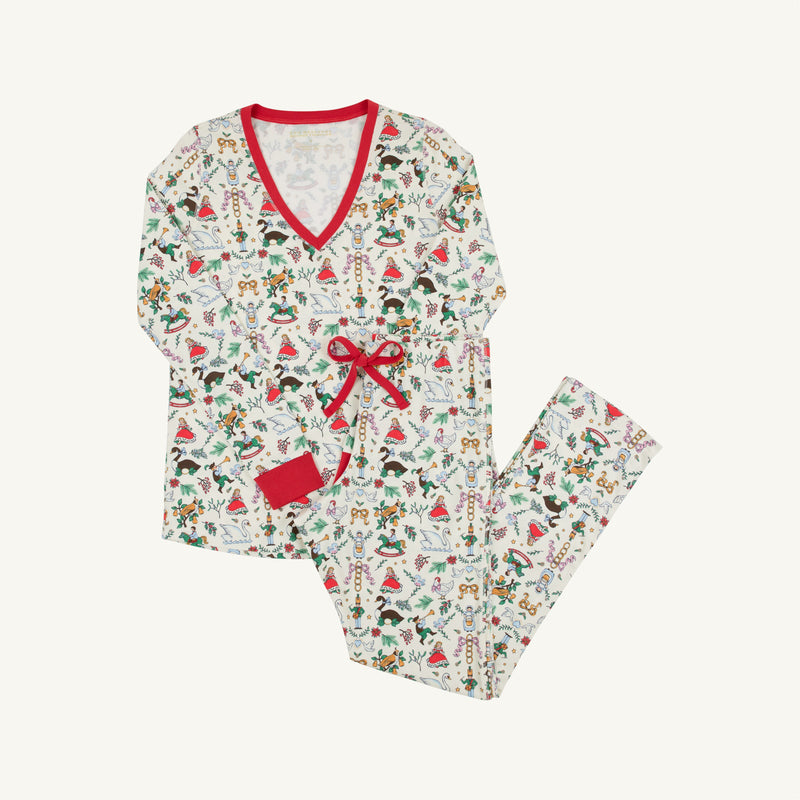The Beaufort Bonnet Company’s Coastal Living Lounge Set - 12 Days of Christmas with Richmond Red features a long-sleeve, V-neck design with red trim and a bow, showcasing a festive holiday print filled with ornaments, gingerbread men, and candy canes on a soft white Pima Cotton background. This cozy pajama set combines seasonal cheer with ultimate comfort.
