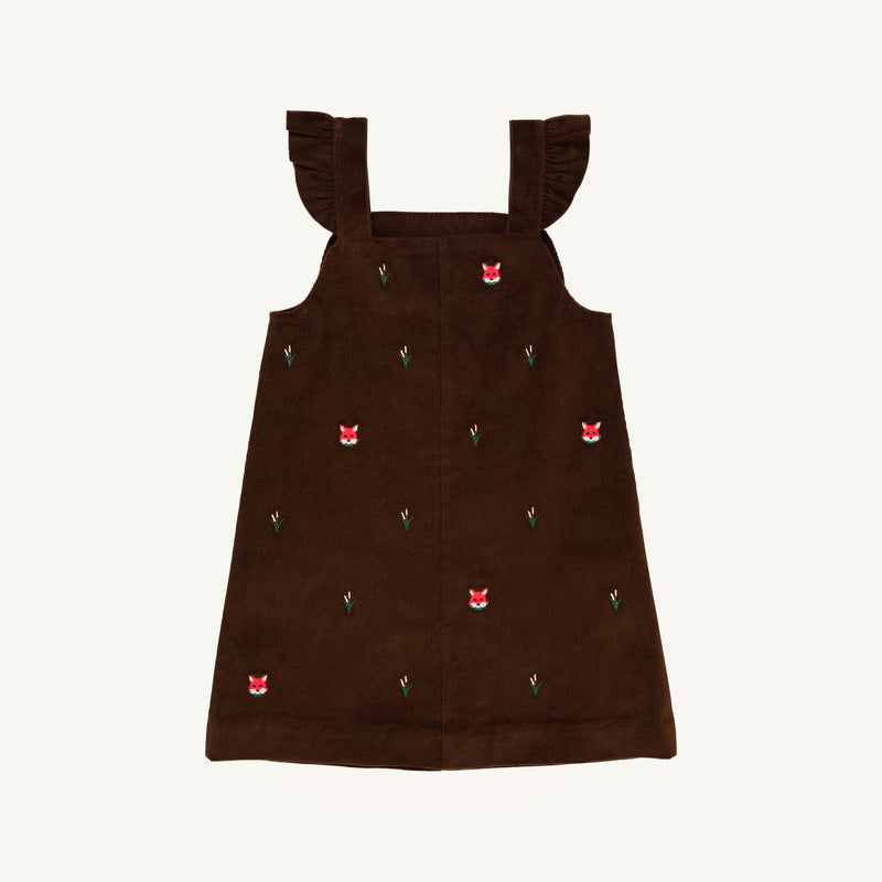 The Beaufort Bonnet Company Critter Julia Jumper in Chelsea Chocolate corduroy features ruffled shoulder straps and delightful fox embroidery with red fox faces and tiny green plants, shown against a white background.